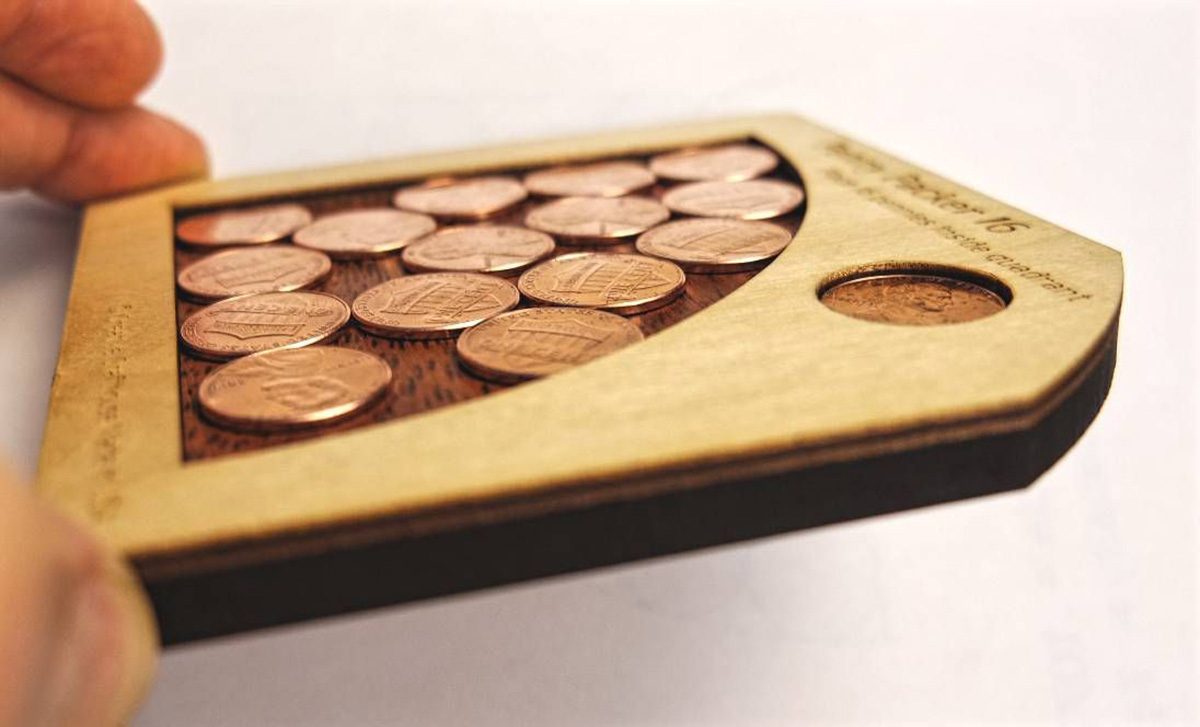 Penny Packer 16 Puzzle place 16 provided mint pennies into opening 
